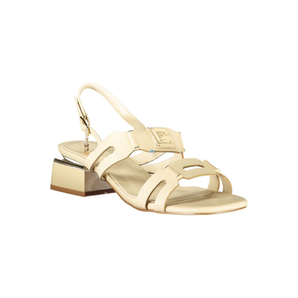 Female model wearing Laura Biagiotti beige polyethylene flat sandals with warm beige straps, lightweight flat construction, and refined Italian detailing, captured mid-step in a casual lifestyle pose showcasing the sandal's understated summer elegance and effortless everyday style.
