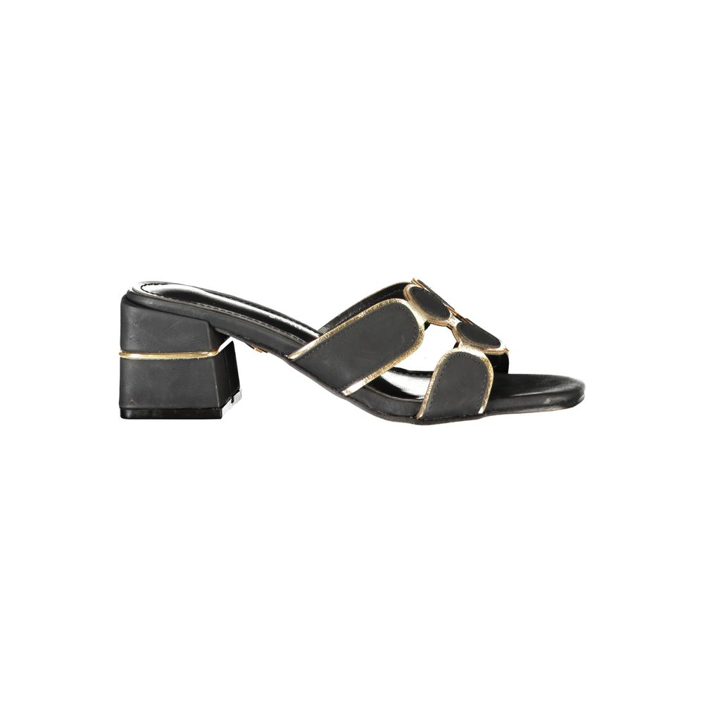 Female model wearing Laura Biagiotti black polyethylene platform sandals with a sleek black upper, bold elevated platform sole, and refined Italian detailing, captured mid-step in a casual lifestyle pose showcasing the sandal's edgy summer style and designer flair