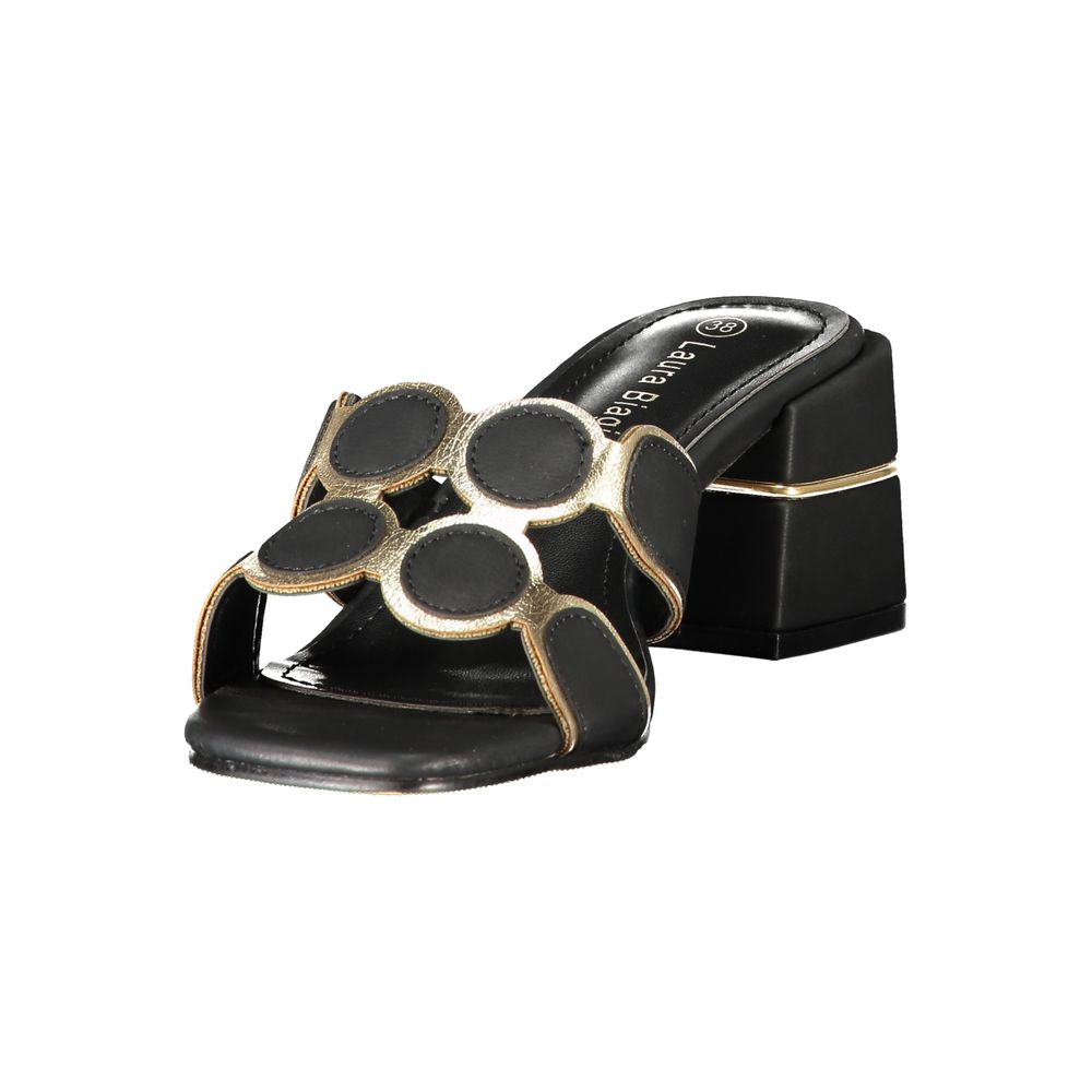 Female model wearing Laura Biagiotti black polyethylene platform sandals with a sleek black upper, bold elevated platform sole, and refined Italian detailing, captured mid-step in a casual lifestyle pose showcasing the sandal's edgy summer style and designer flair
