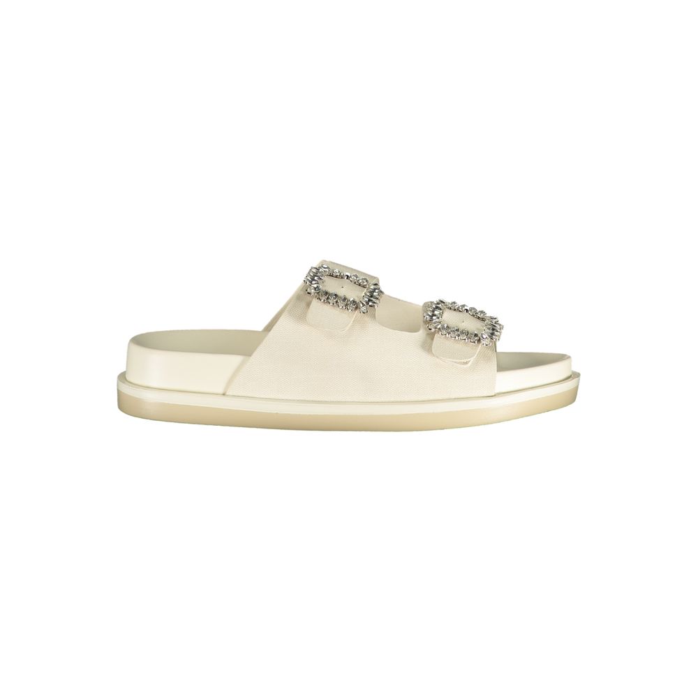 Female model wearing Laura Biagiotti white polyethylene flat sandals with clean white straps, lightweight flat construction, and refined Italian detailing, captured mid-step in a casual lifestyle pose showcasing the sandal's minimalist summer elegance and effortless everyday style."