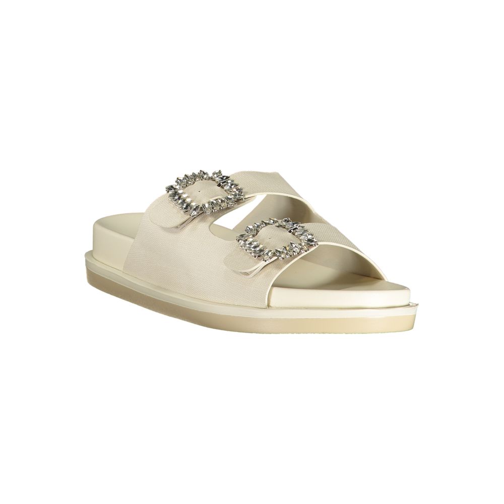 Female model wearing Laura Biagiotti white polyethylene flat sandals with clean white straps, lightweight flat construction, and refined Italian detailing, captured mid-step in a casual lifestyle pose showcasing the sandal's minimalist summer elegance and effortless everyday style."