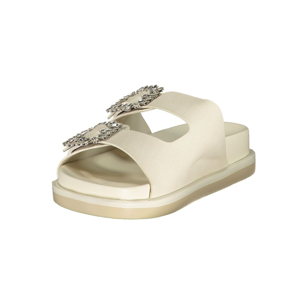 Female model wearing Laura Biagiotti white polyethylene flat sandals with clean white straps, lightweight flat construction, and refined Italian detailing, captured mid-step in a casual lifestyle pose showcasing the sandal's minimalist summer elegance and effortless everyday style."