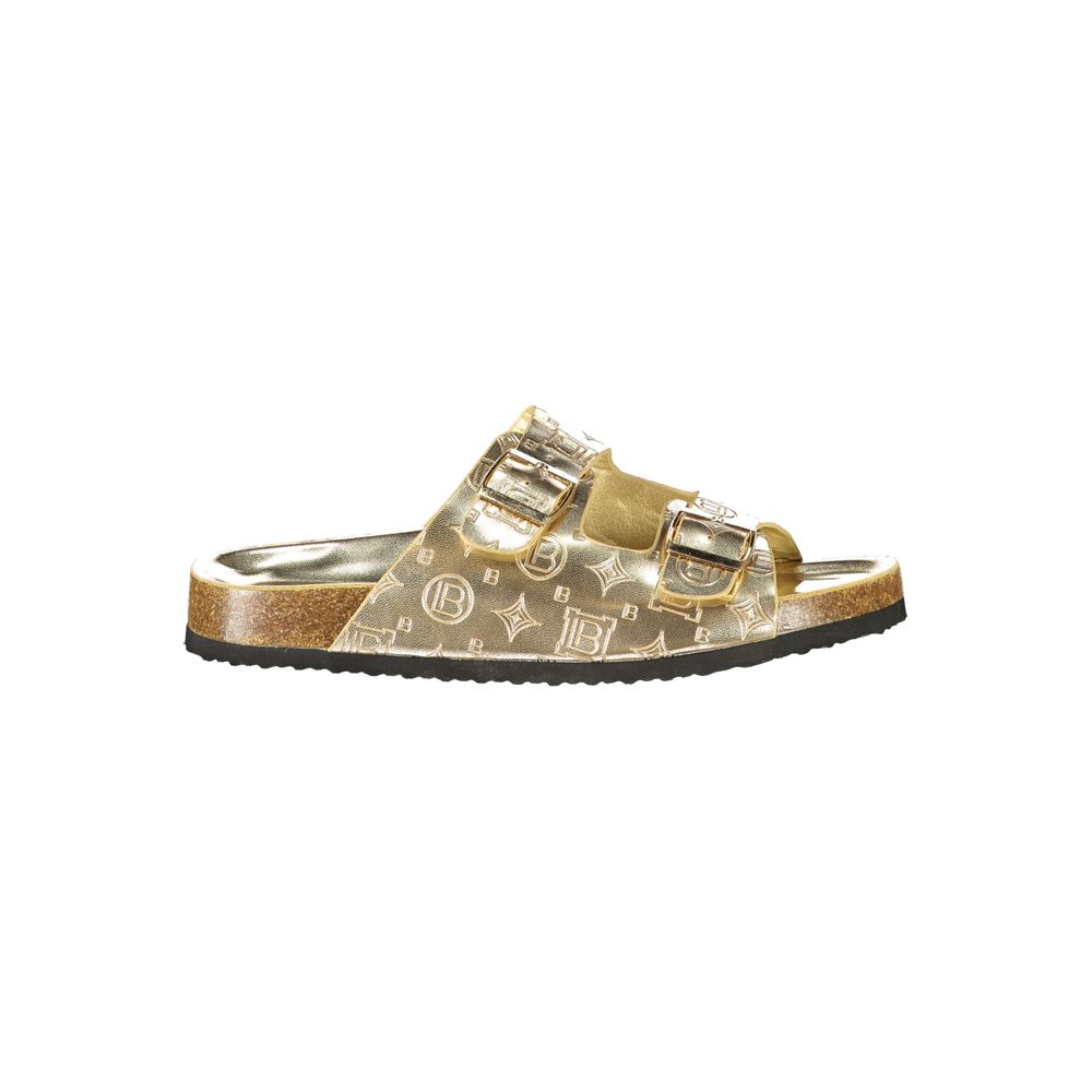 Female model wearing Laura Biagiotti gold polyethylene flat sandals with lustrous gold-tone straps, lightweight construction, and refined Italian detailing, captured mid-step in a casual lifestyle pose showcasing the sandal's glamorous summer elegance and effortless designer style