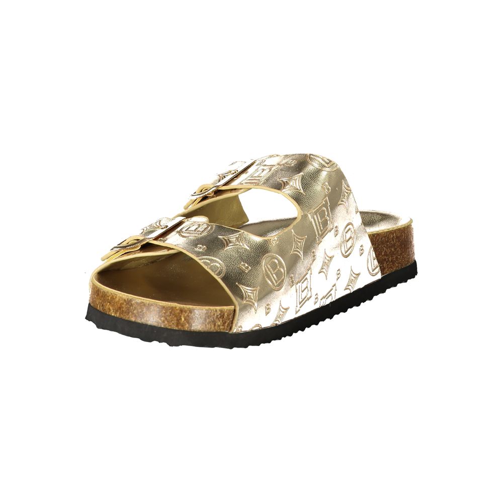 Female model wearing Laura Biagiotti gold polyethylene flat sandals with lustrous gold-tone straps, lightweight construction, and refined Italian detailing, captured mid-step in a casual lifestyle pose showcasing the sandal's glamorous summer elegance and effortless designer style