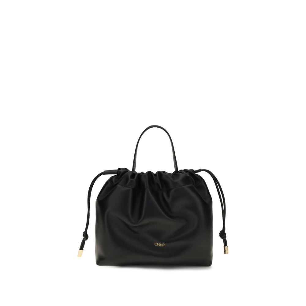 Chloé black lambskin shoulder bag with a gathered drawstring top, top handle, and gold-tone logo.