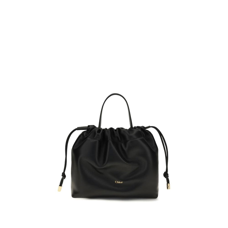 Chloé black lambskin shoulder bag with a gathered drawstring top, top handle, and gold-tone logo.