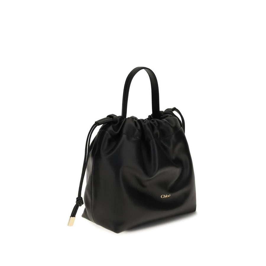 Chloé black lambskin shoulder bag with a gathered drawstring top, top handle, and gold-tone logo.