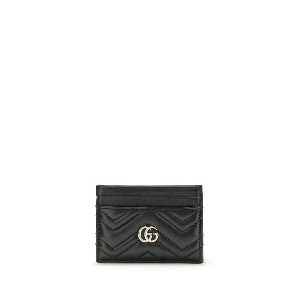 Gucci black leather card wallet with chevron quilting and gold interlocking G logo.