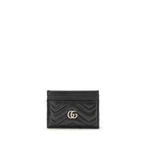 Gucci black leather card wallet with chevron quilting and gold interlocking G logo.