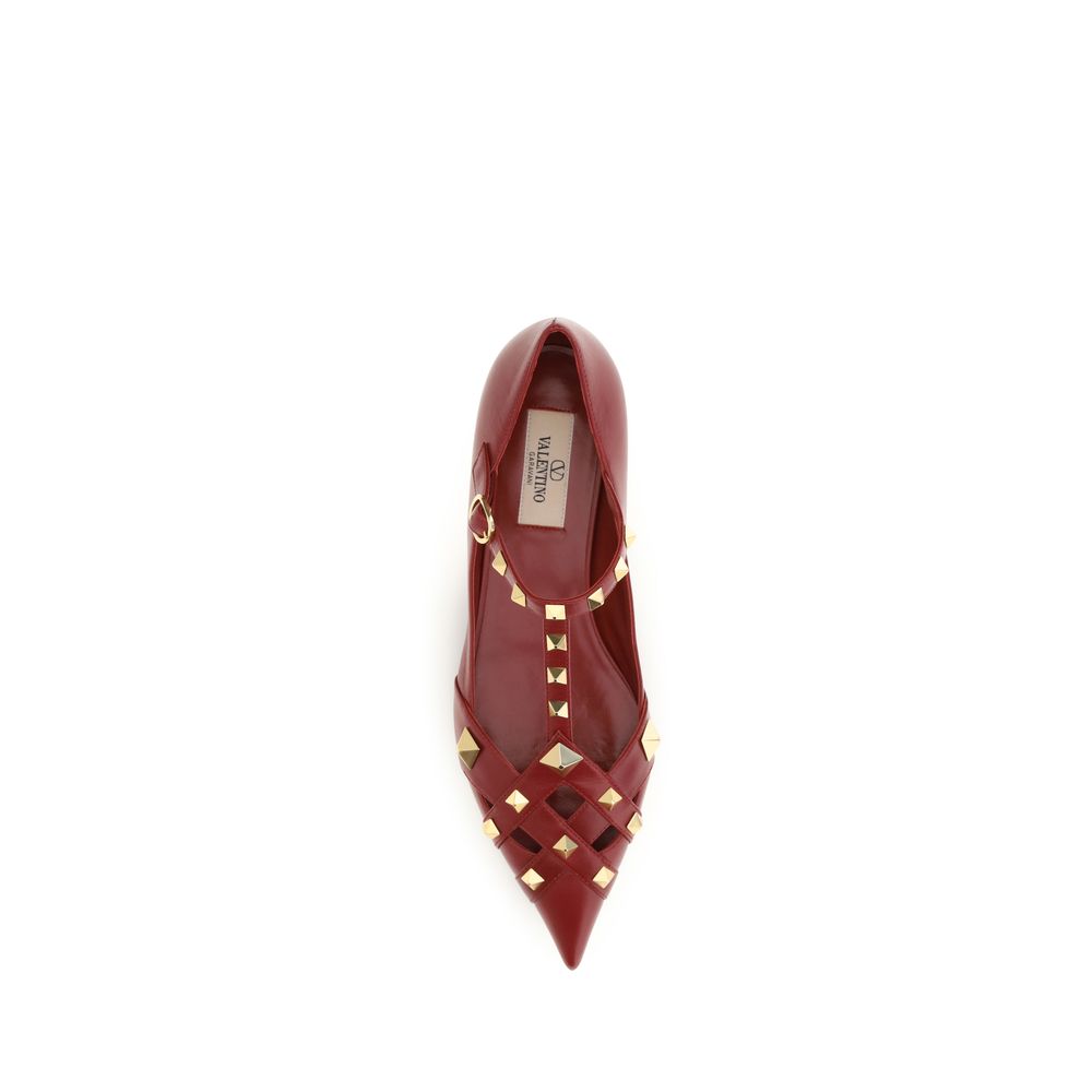 Red studded shoe on a white background