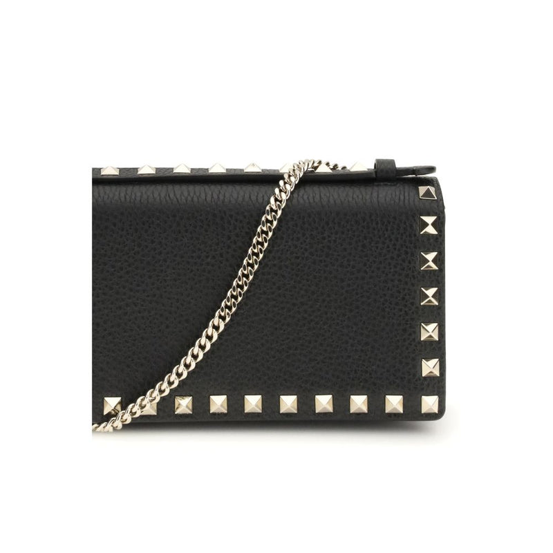 Black leather Valentino Garavani wallet with gold studs and chain strap