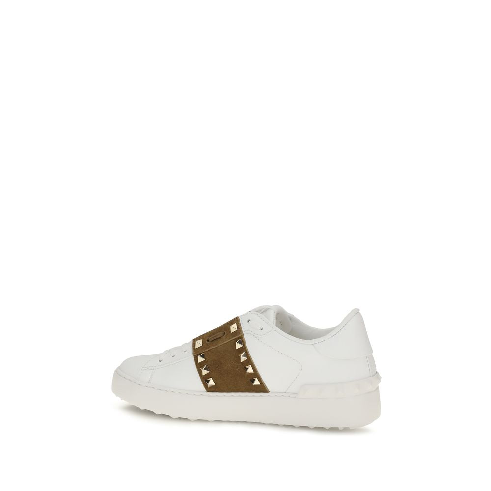 White sneaker with brown accents on a white background