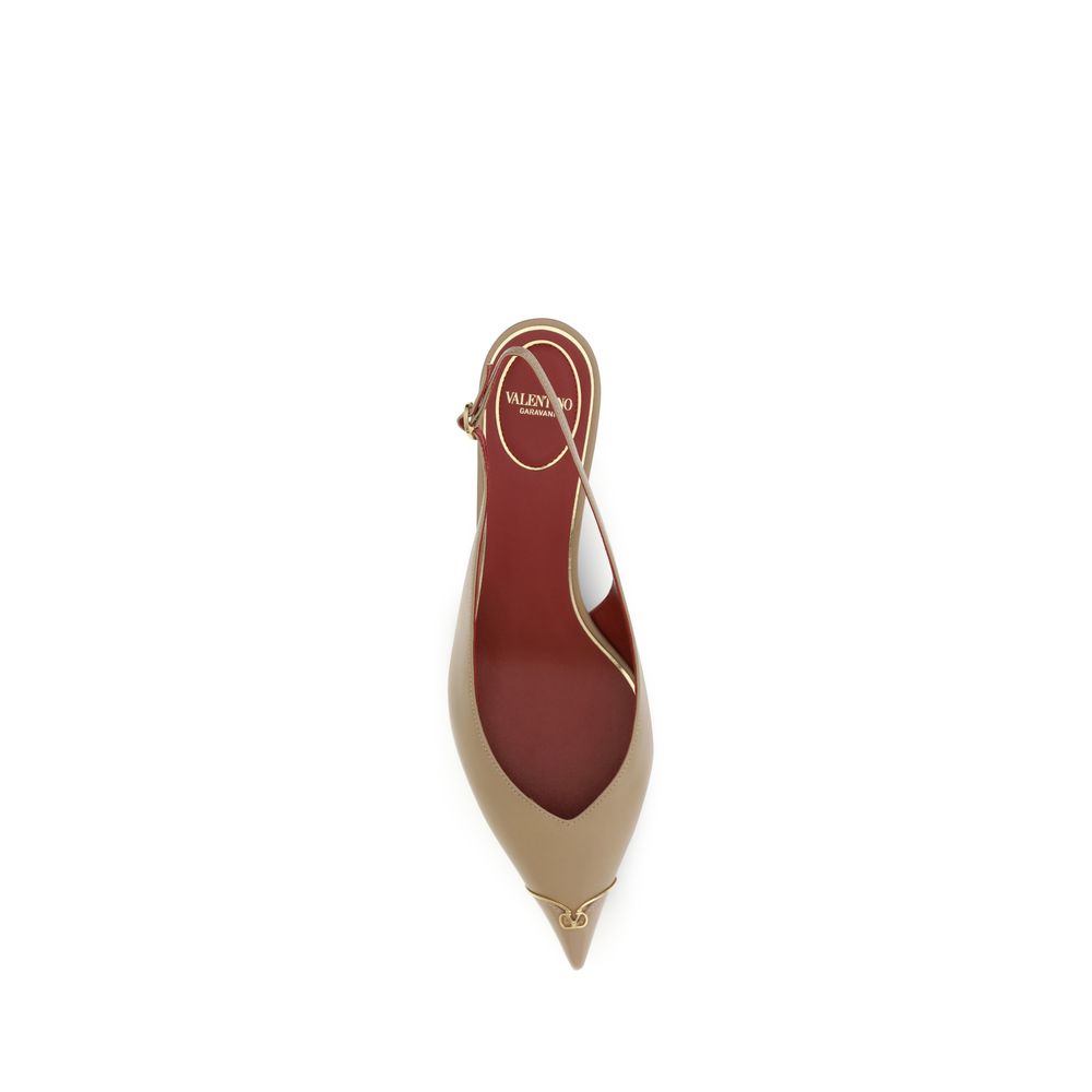 High-heeled shoe with a pointed toe and red insole on a white background