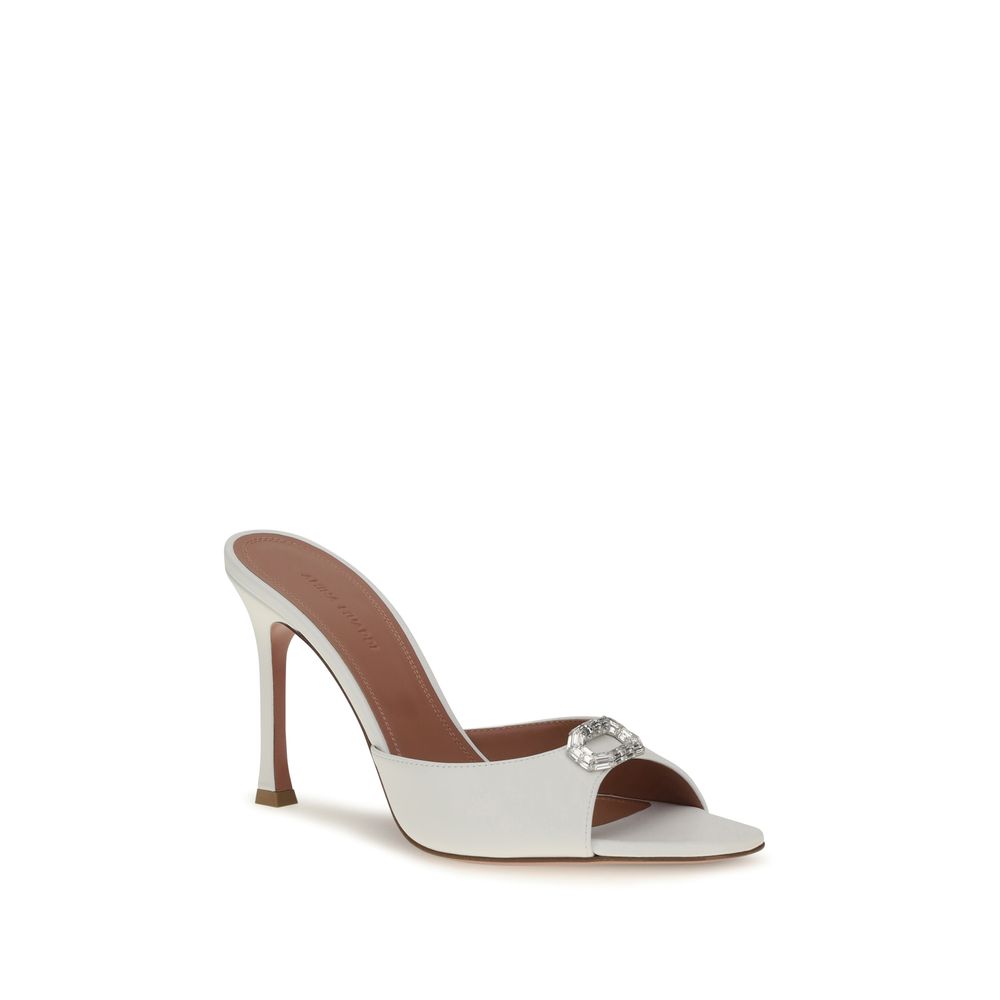 White high-heeled sandal with a brown insole on a white background