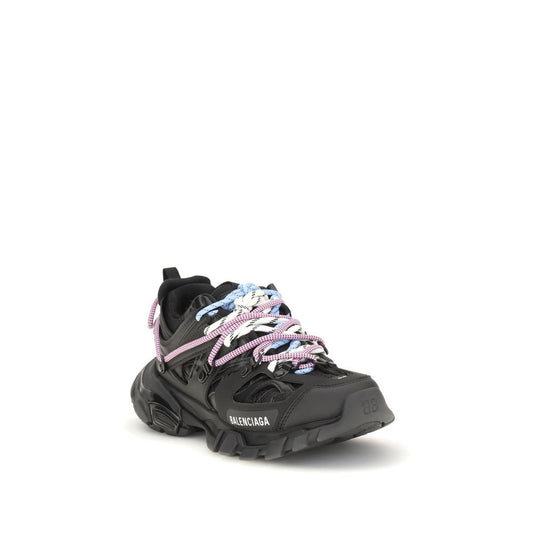 Black sneaker with pink floral laces on a white background