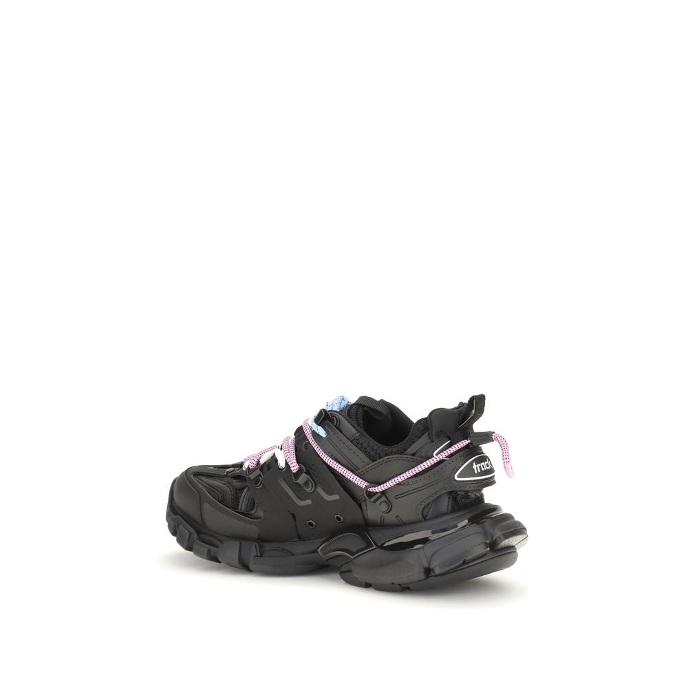 Black sneakers with pink accents on a white background