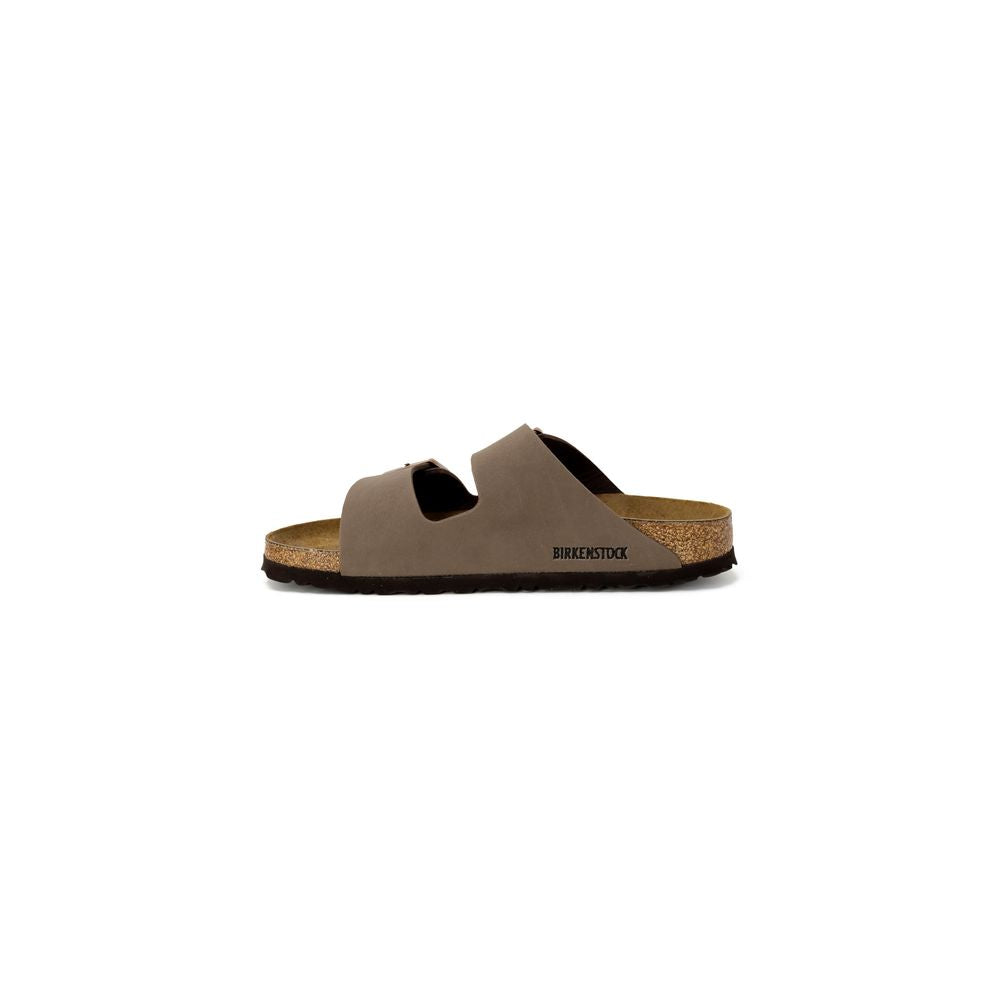 Brown sandal with cork footbed on a white background