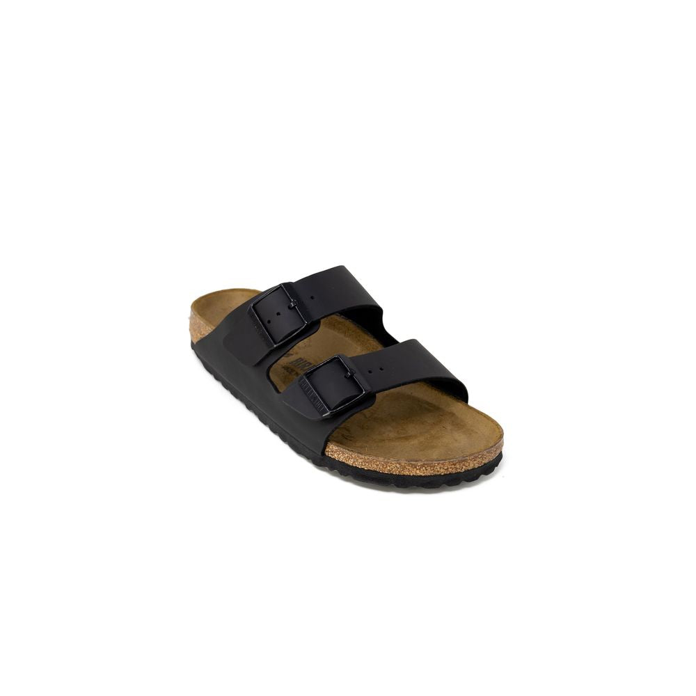 Black sandal with cork footbed on a white background