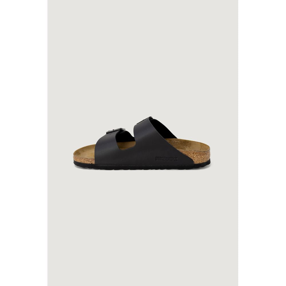 Black sandal with cork sole on a light gray background