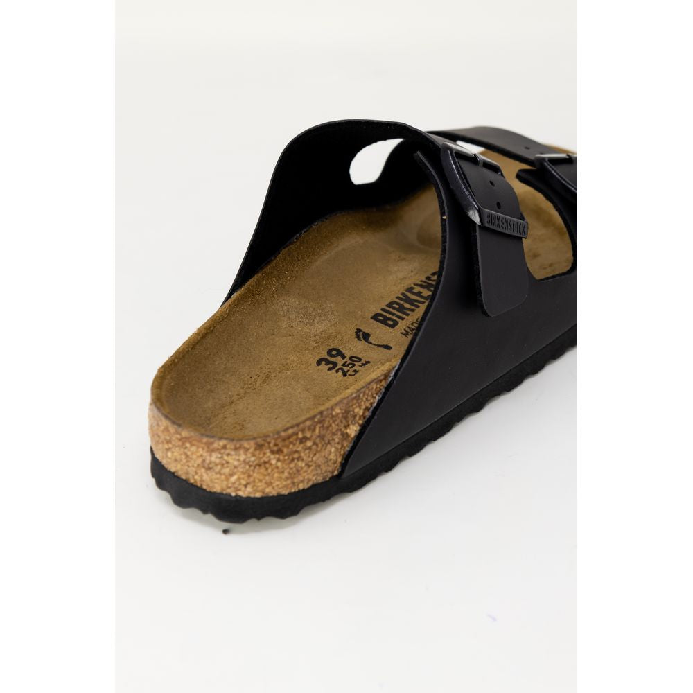 Black sandal with cork insole on a white background