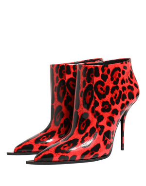 Red high-heeled boots with black leopard print pattern on a white background