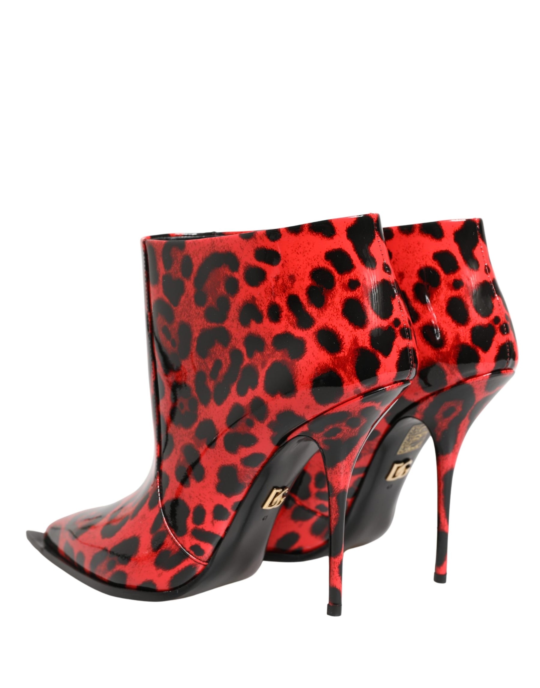 Red high-heeled boots with black leopard print pattern on a white background
