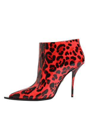 Red high-heeled boot with black leopard print pattern on a white background