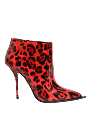 Red high-heeled boots with black leopard print pattern on a white background