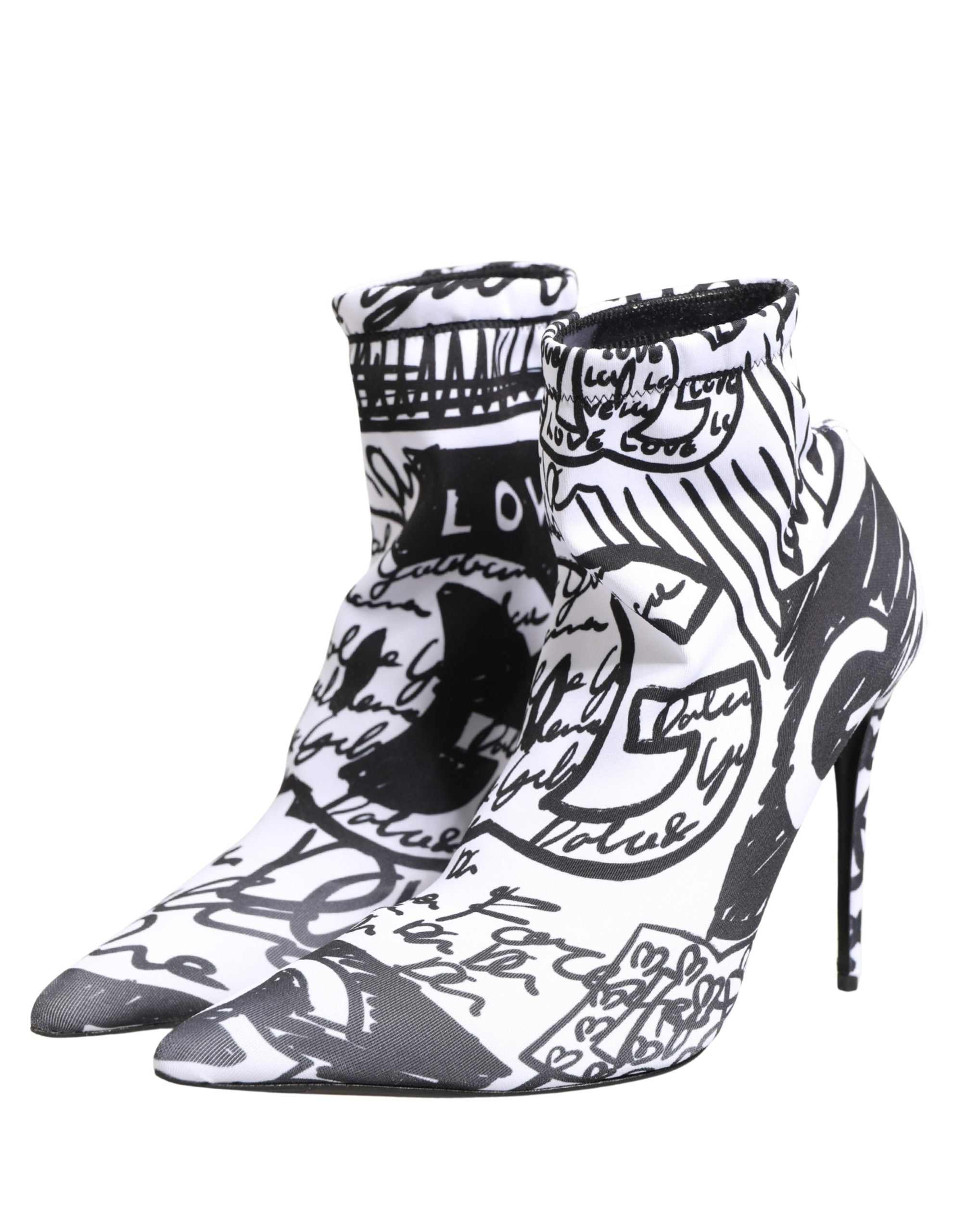 Black and white high-heeled shoes with artistic design on a white background