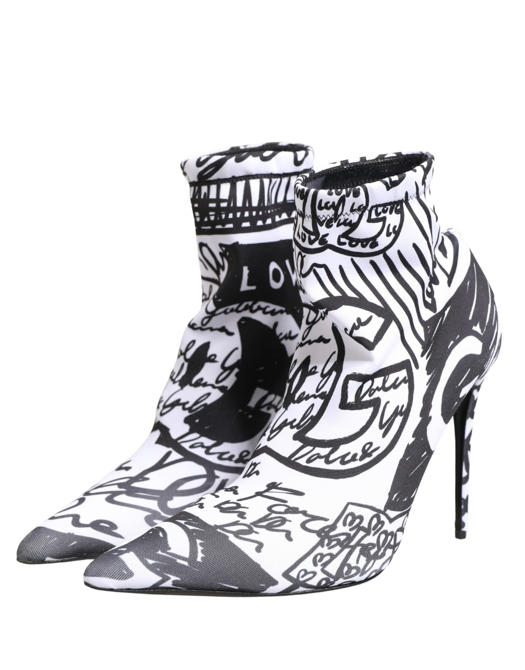 Black and white high-heeled shoes with artistic design on a white background