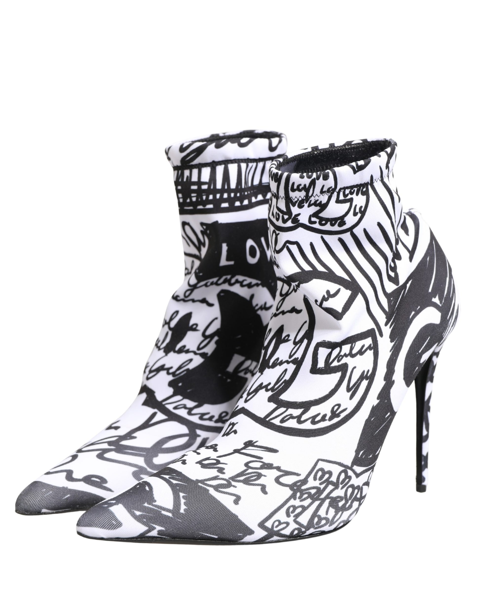 Black and white high-heeled shoes with artistic design on a white background