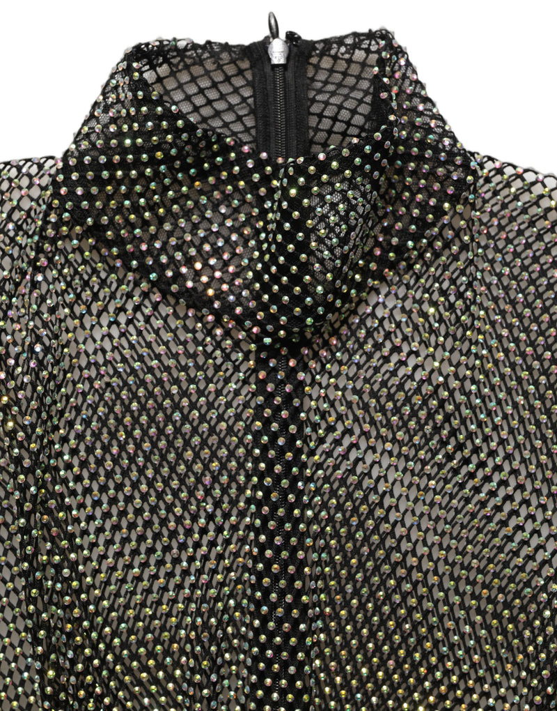 Close-up of a black mesh turtleneck dress embellished with sparkling rhinestones and a back zipper