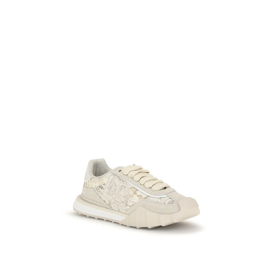White sneaker with decorative elements on a white background