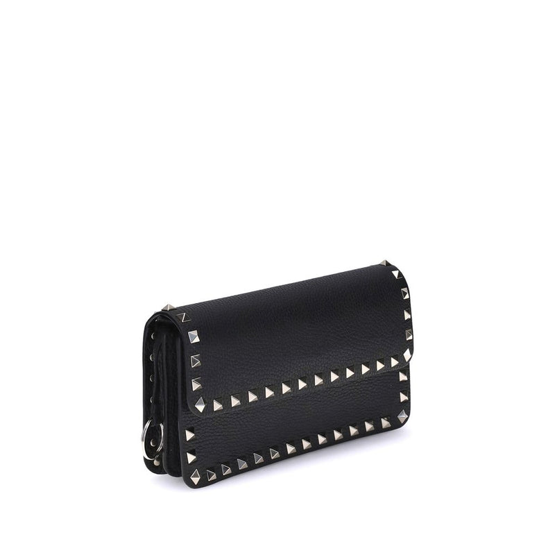 Black calf leather wallet with silver studs along the edges and flap closure