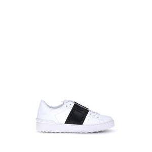 White sneaker with a black stripe on a white background