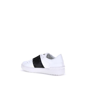 White sneaker with a black band on a white background