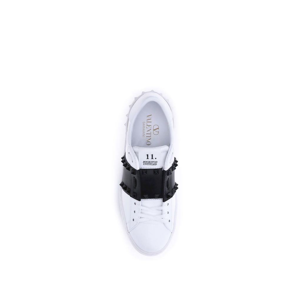 White sneaker with black decorative element on a white background