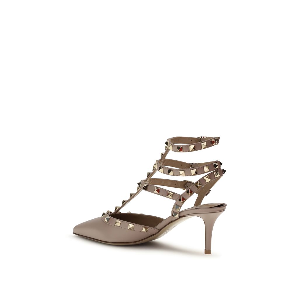 High-heeled shoe with studded design on a white background