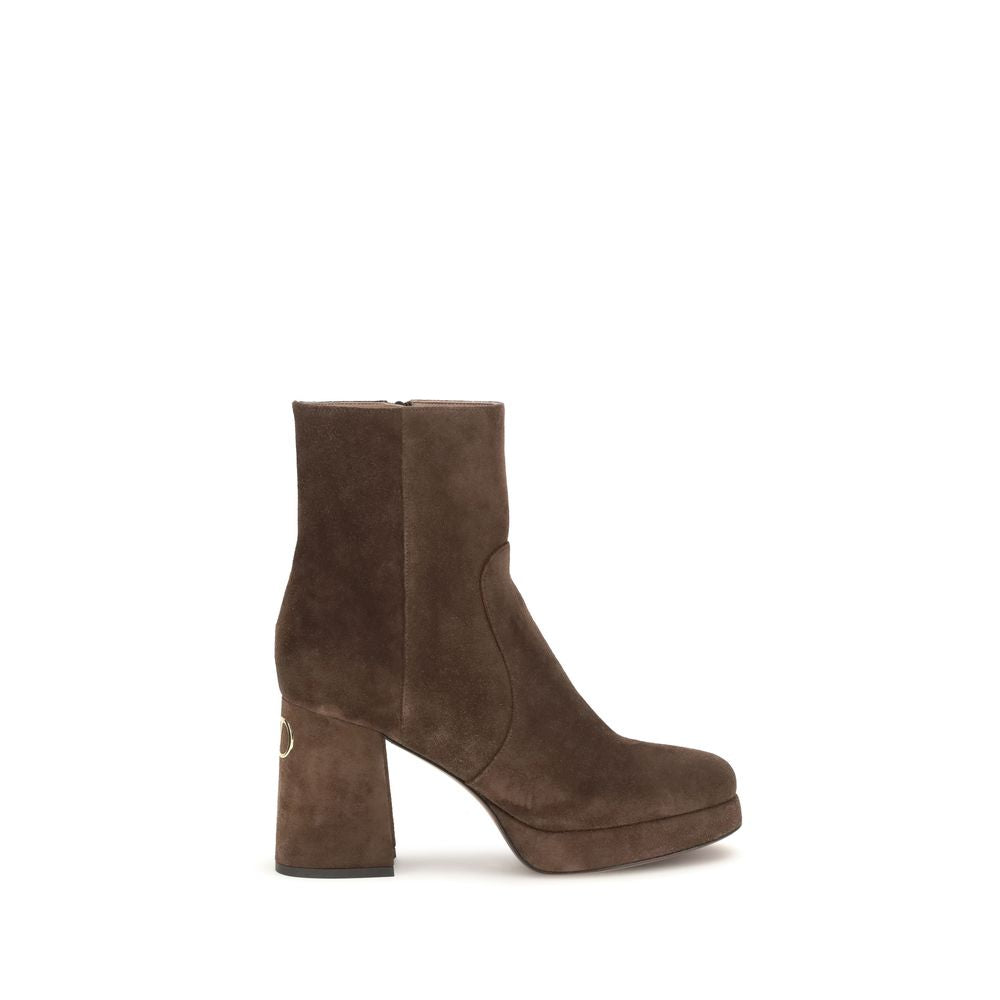 Brown suede ankle boot on a white background