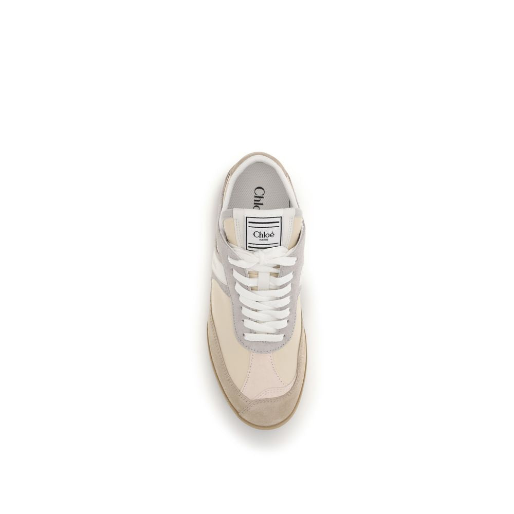 Beige sneaker with white laces on a white background