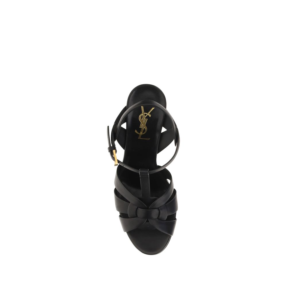 Black sandal with a brand logo on a white background