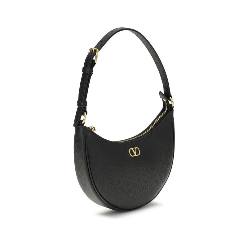 Black calf leather crescent shoulder bag with a curved top handle, gold zipper, and gold V logo