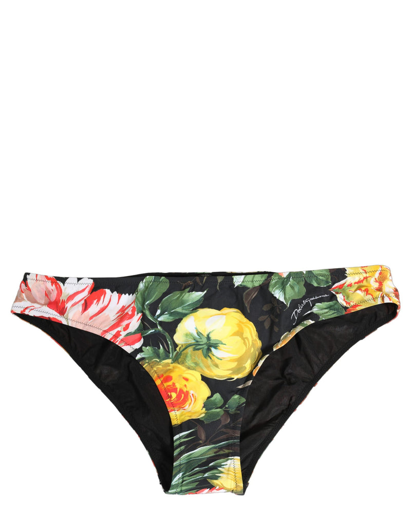 Black nylon bikini bottom featuring a colorful floral print with red, yellow, and white flowers and green leaves