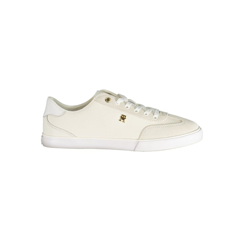 White sneaker with a small logo on a white background