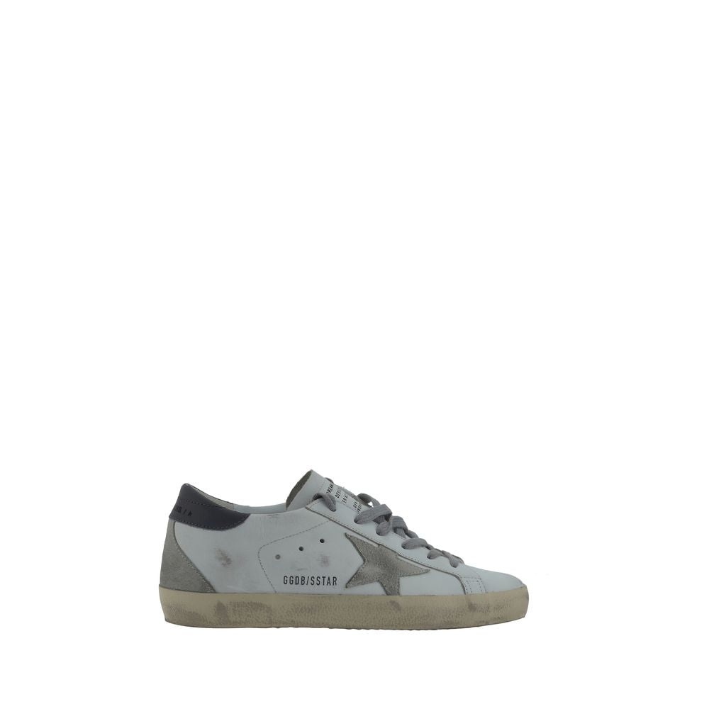Distressed white goatskin Golden Goose low-top sneakers with a grey suede star and heel tab, plus vintage-look sole.