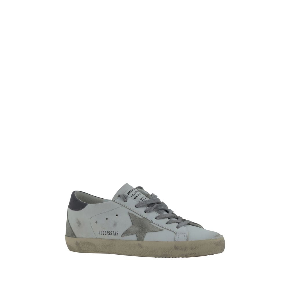 Golden Goose white goatskin low-top sneaker with gray suede star, lace-up closure, and distressed vintage sole.