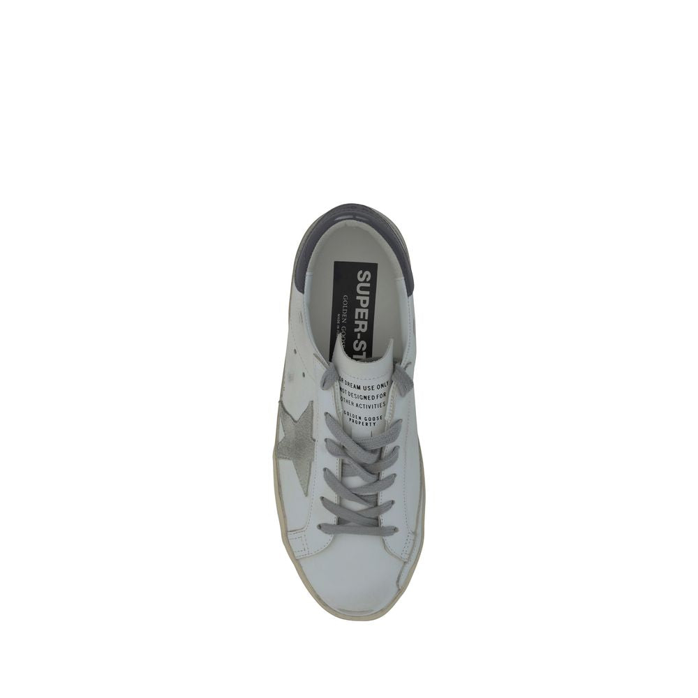 Top-down view of a white goatskin Golden Goose low-top sneaker with gray laces, suede star, and heel tab.