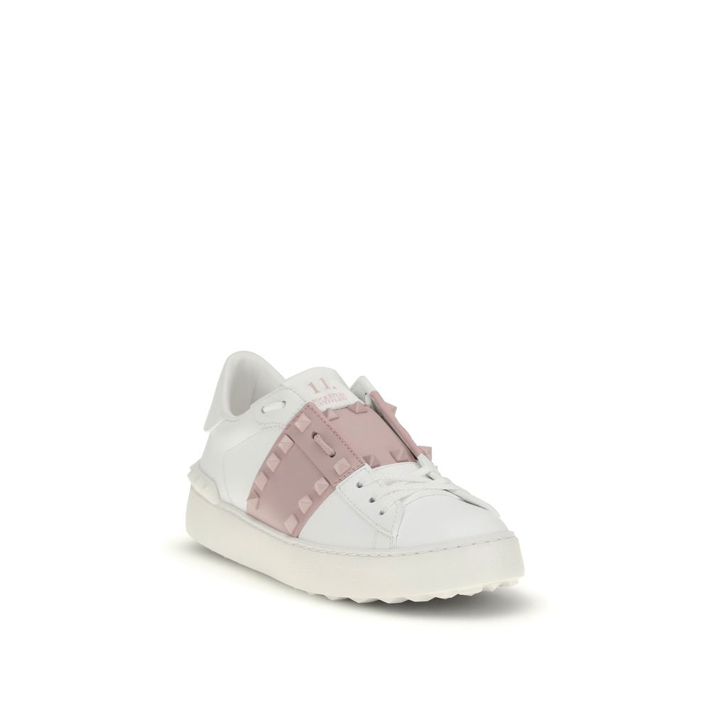 White sneaker with pink accents on a white background