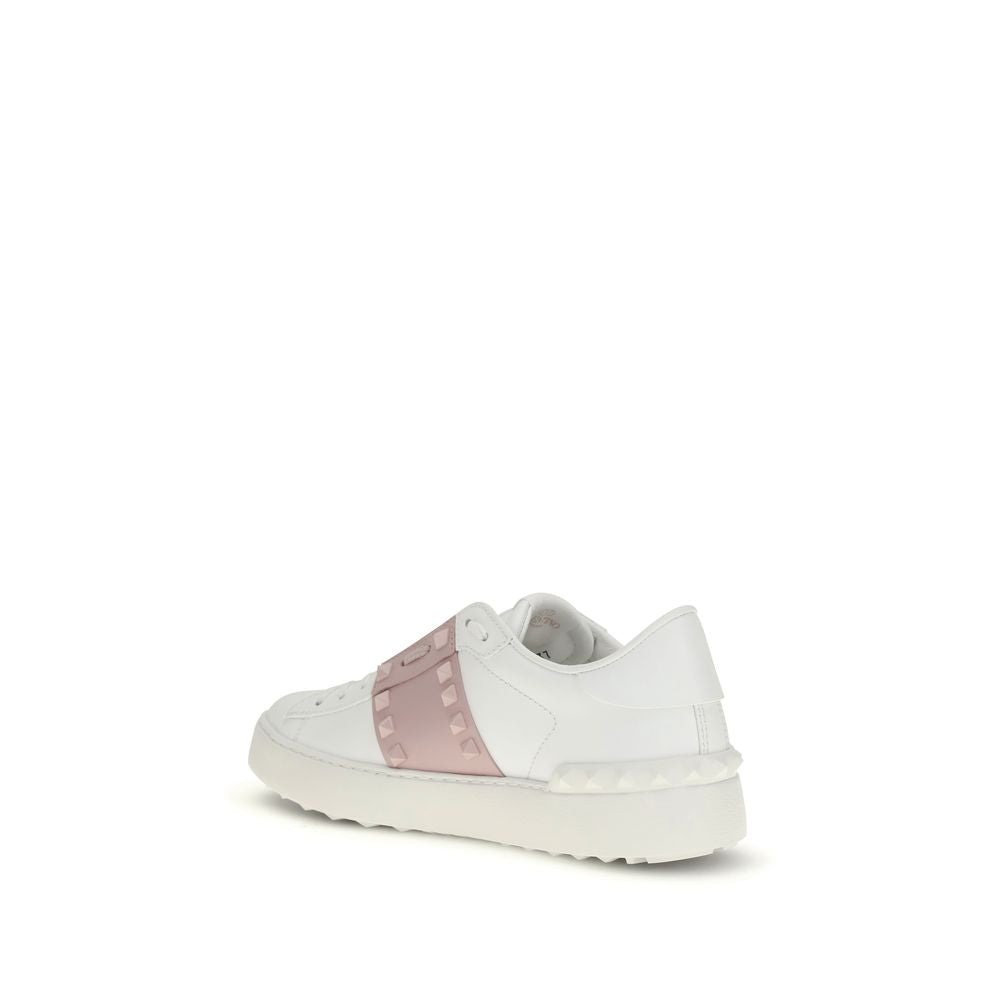 White sneaker with a pink accent on a white background