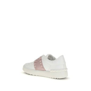 White sneaker with a pink accent on a white background